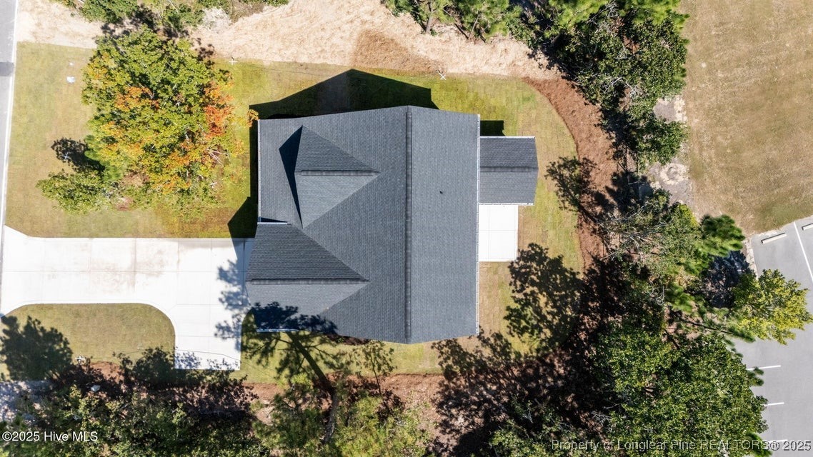 1420 Burning Tree Road Pinehurst, NC 28374 - Photo 7 of 50 an aerial view of a house with a yard
