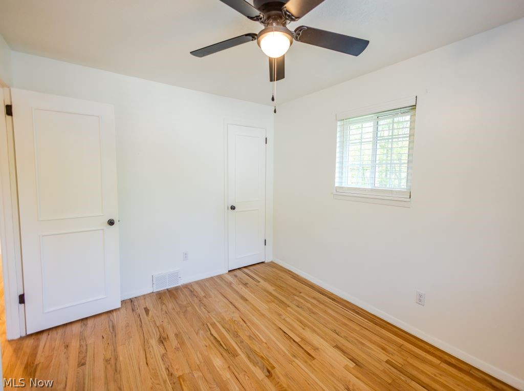 8828 Edgehill Road Mentor, OH 44060 - Photo 15 of 24 Unfurnished room with ceiling fan and light hardwood / wood-style floors