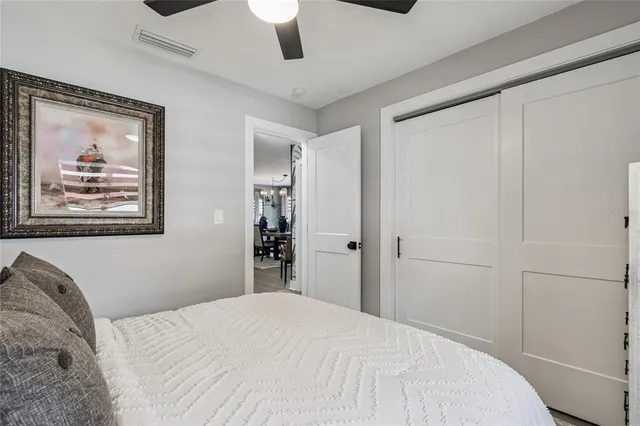 a kitchen with a table chairs refrigerator and cabinets