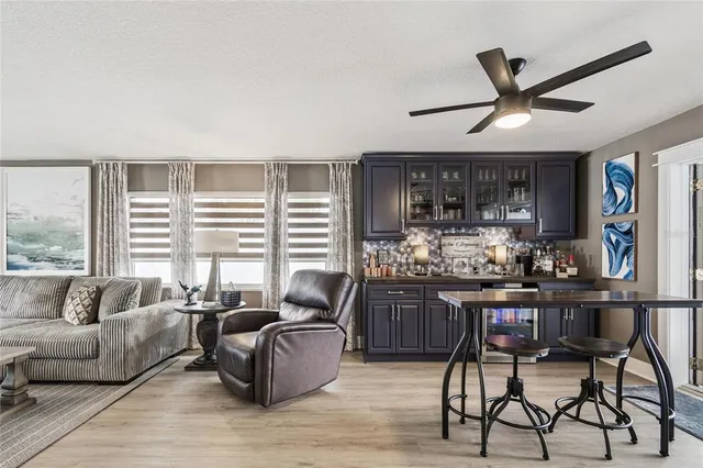 a dining room with furniture and wooden floor