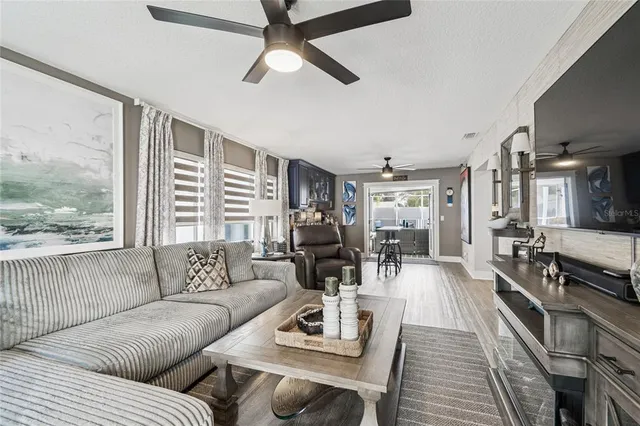 a living room with furniture and a large window