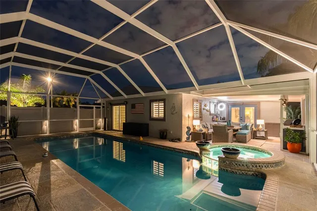 a backyard of a house with table and chairs