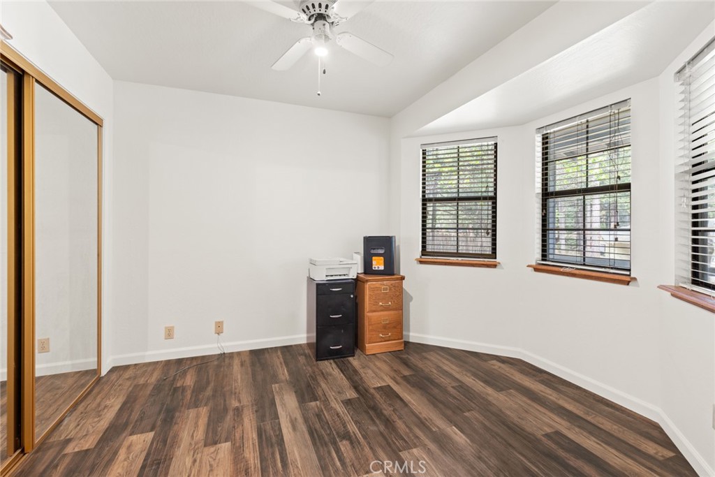 6350 Amherst Way Magalia, CA 95954 - Photo 13 of 25 wooden floor in an empty room with a window