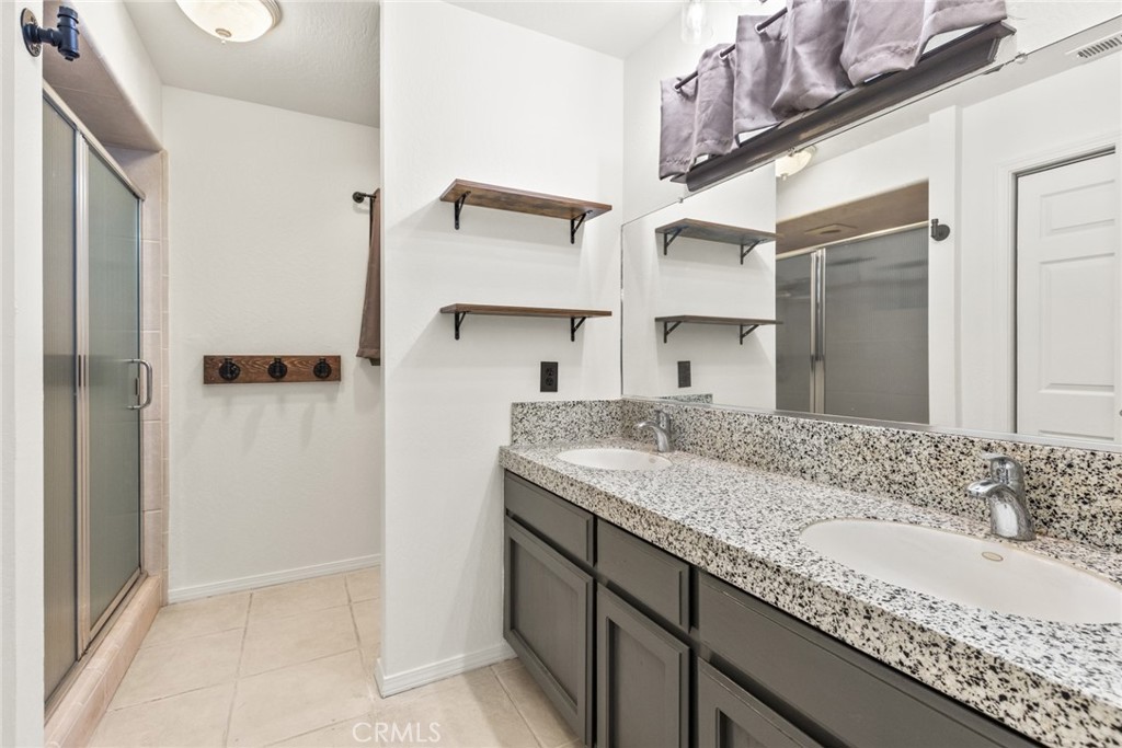 6350 Amherst Way Magalia, CA 95954 - Photo 15 of 25 a bathroom with a granite countertop sink and a mirror