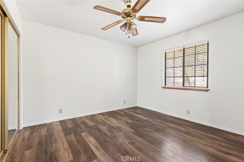 6350 Amherst Way Magalia, CA 95954 - Photo 16 of 25 an empty room with a window and a fan