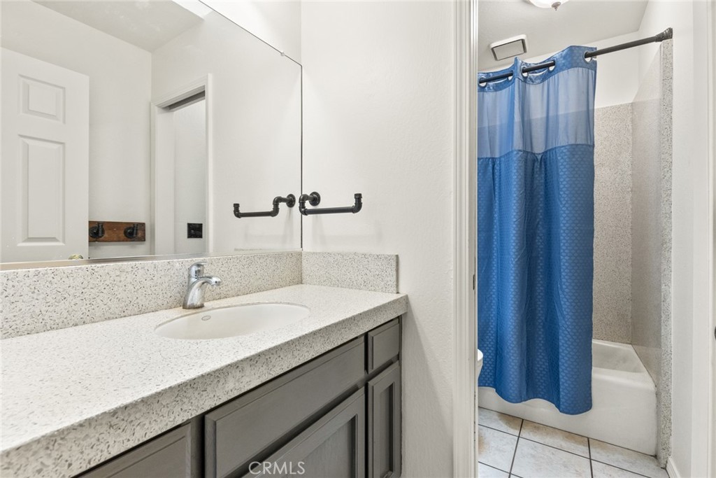 6350 Amherst Way Magalia, CA 95954 - Photo 17 of 25 a bathroom with a sink vanity granite tub and shower
