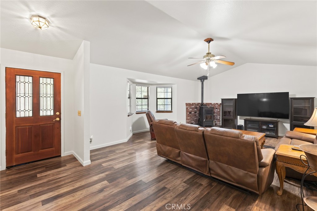 6350 Amherst Way Magalia, CA 95954 - Photo 2 of 25 a living room with furniture and a flat screen tv