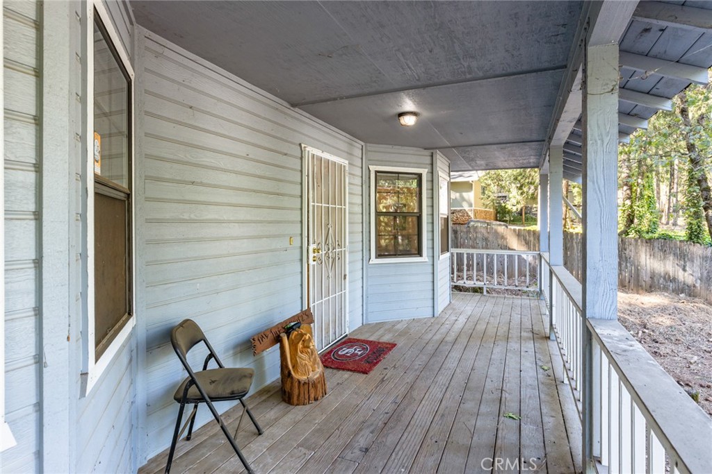 6350 Amherst Way Magalia, CA 95954 - Photo 22 of 25 a view of a chairs and table on the wooden deck