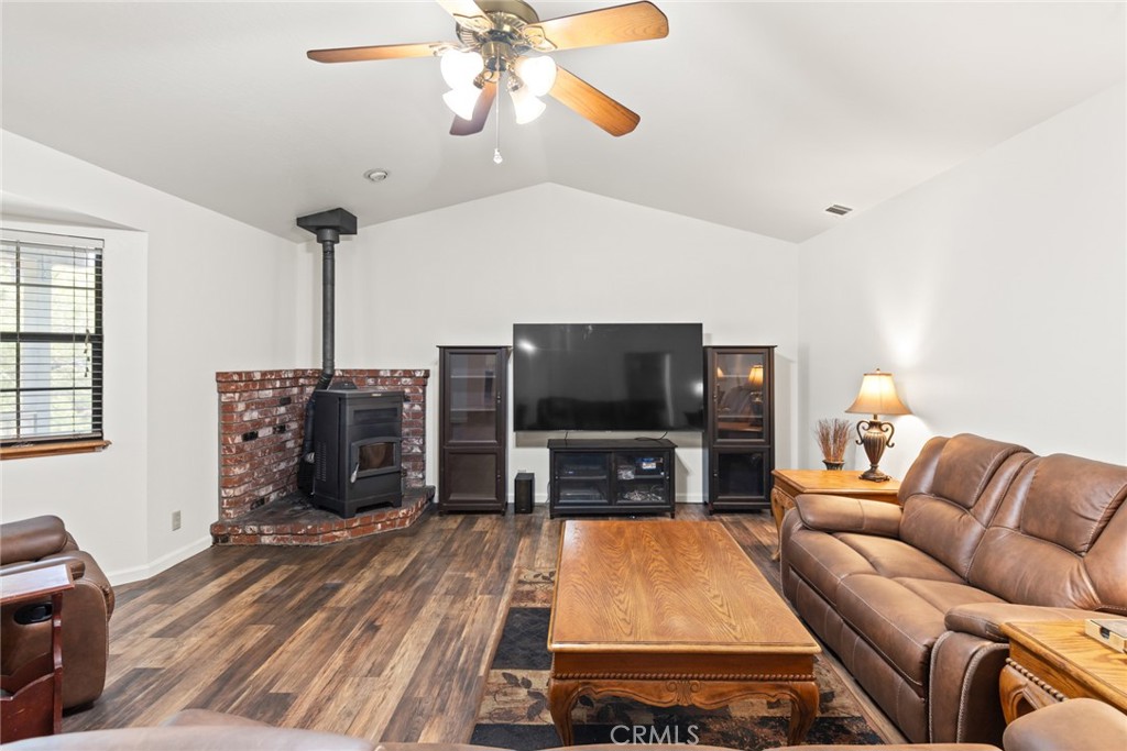 6350 Amherst Way Magalia, CA 95954 - Photo 3 of 25 a living room with furniture and a flat screen tv