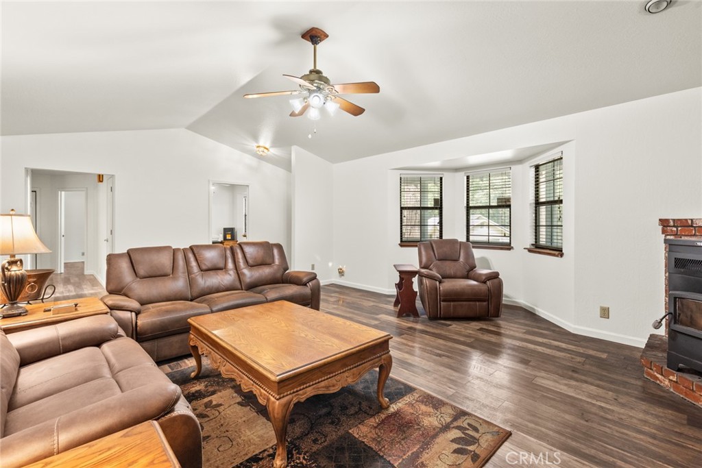 6350 Amherst Way Magalia, CA 95954 - Photo 6 of 25 a living room with furniture a ceiling fan and a window