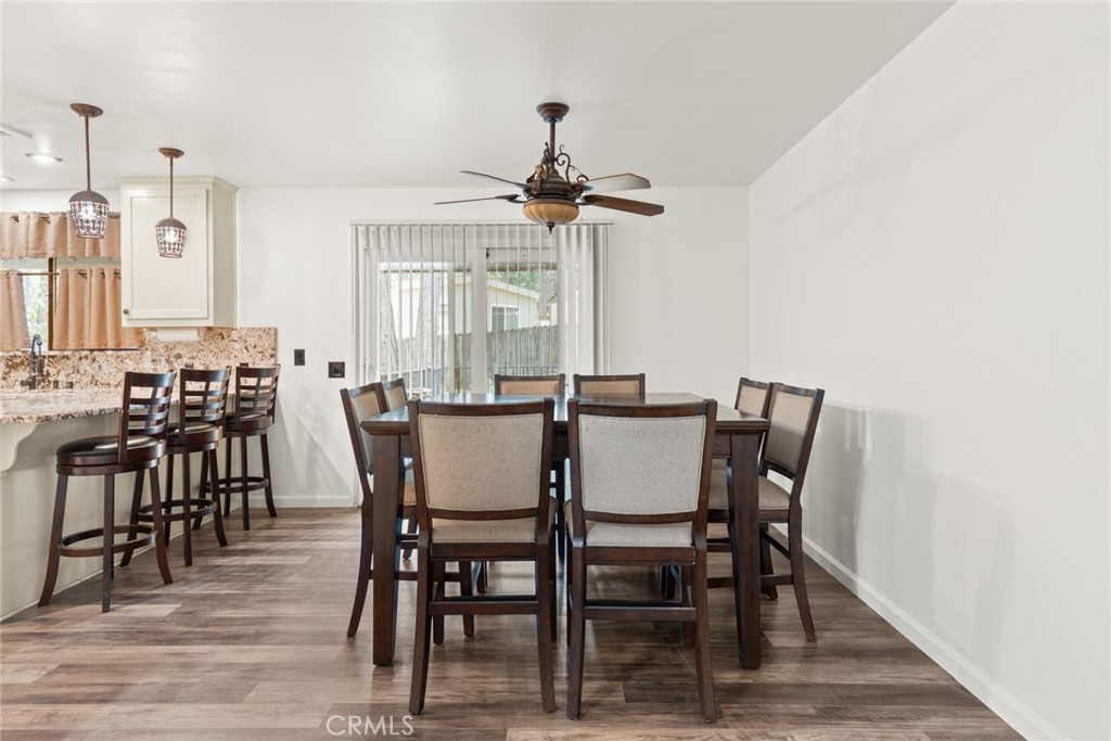 6350 Amherst Way Magalia, CA 95954 - Photo 8 of 25 a view of a dining room with furniture window and wooden floor