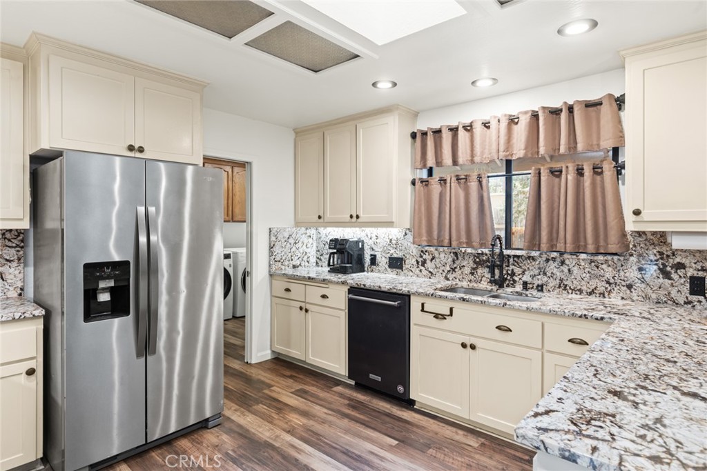 6350 Amherst Way Magalia, CA 95954 - Photo 10 of 25 a kitchen with stainless steel appliances granite countertop a refrigerator and a sink