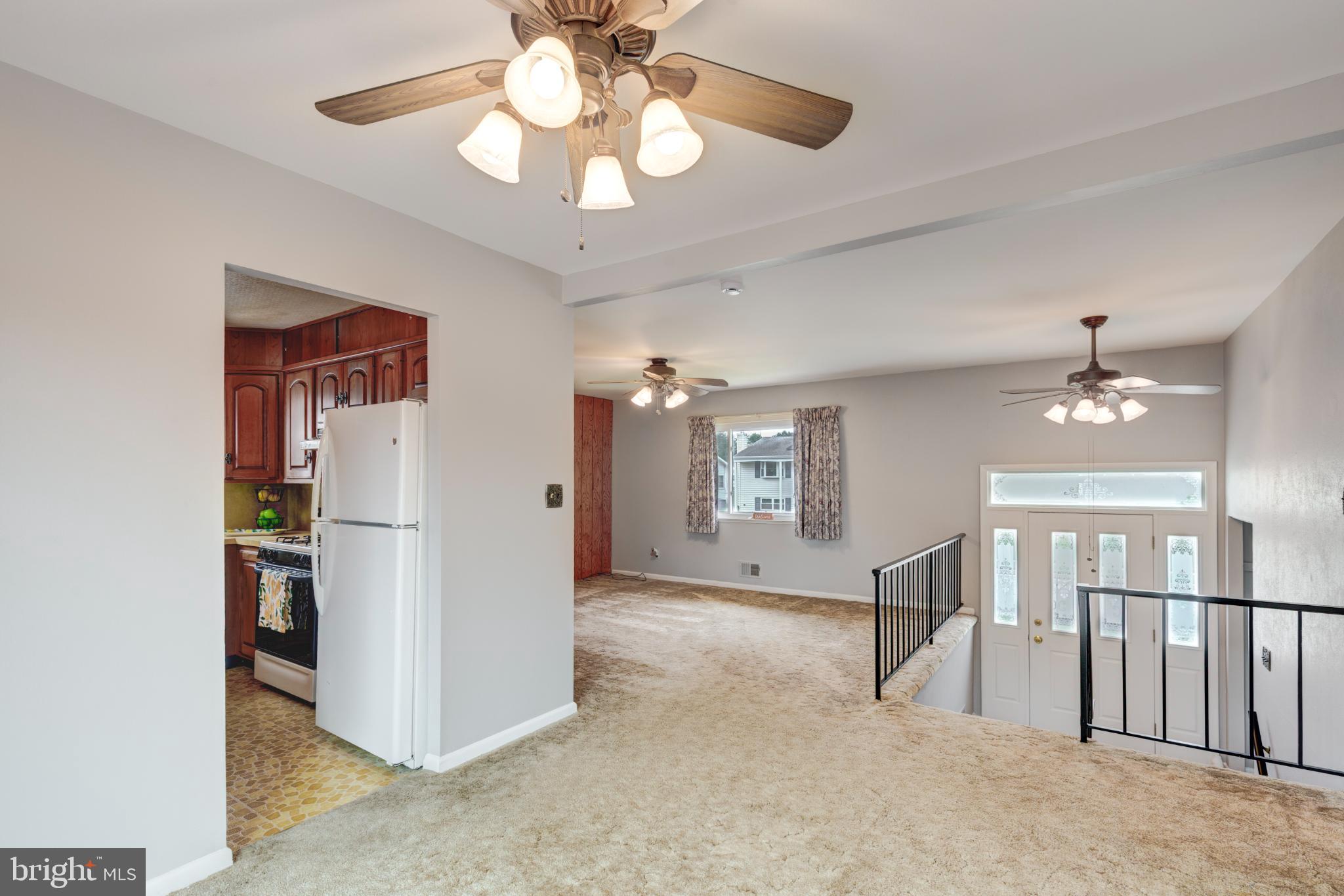 520 Crisfield Road Baltimore, MD 21220 - Photo 13 of 27 a view of a livingroom with a chandelier