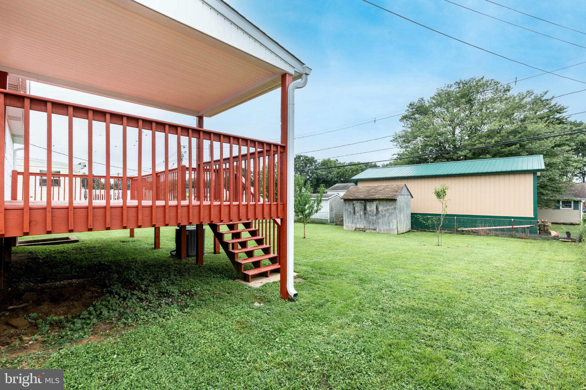 520 Crisfield Road Baltimore, MD 21220 - Photo 6 of 27 a view of a backyard with plants and a garden