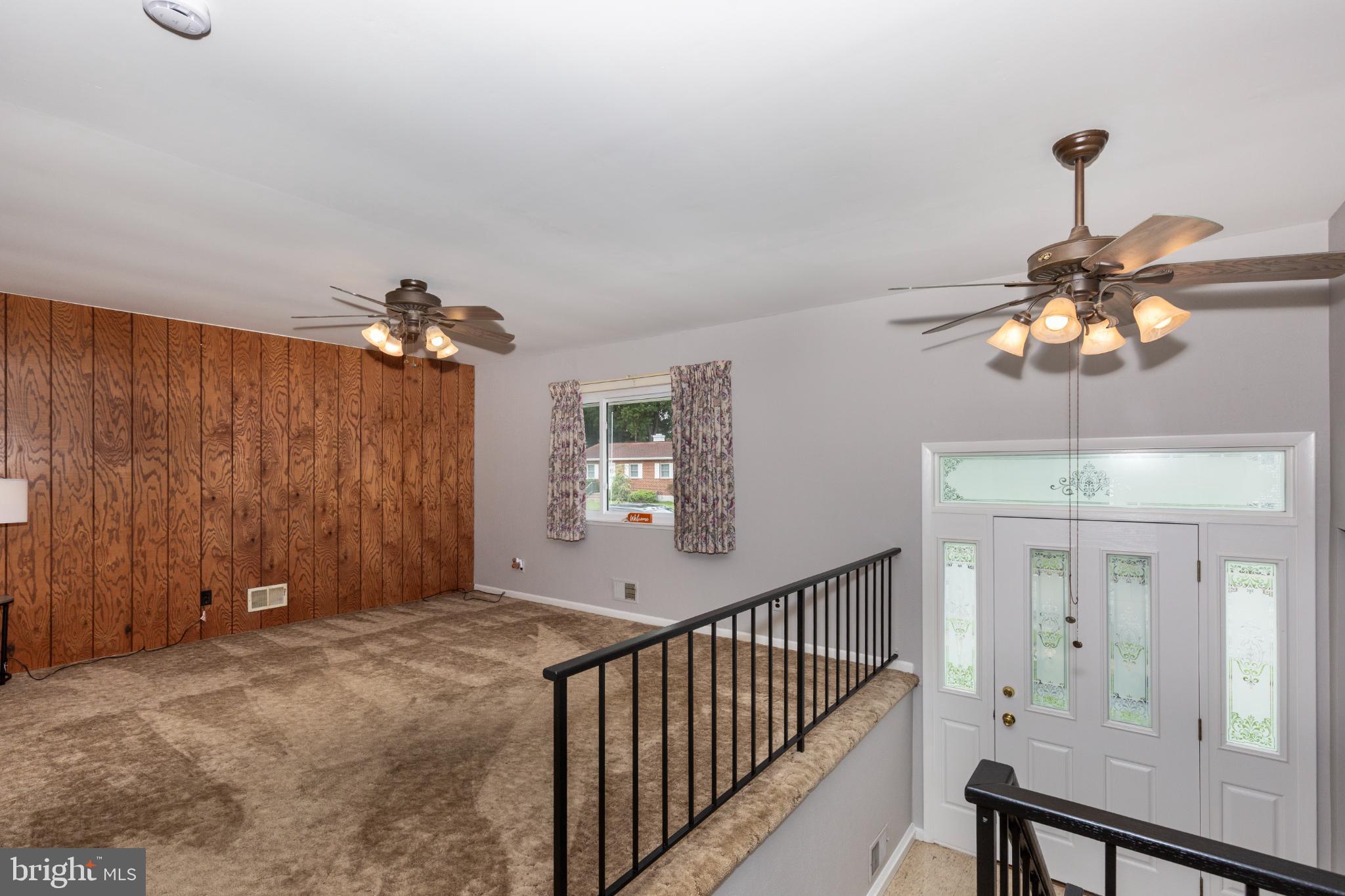 520 Crisfield Road Baltimore, MD 21220 - Photo 9 of 27 a view of a chandelier fan and windows