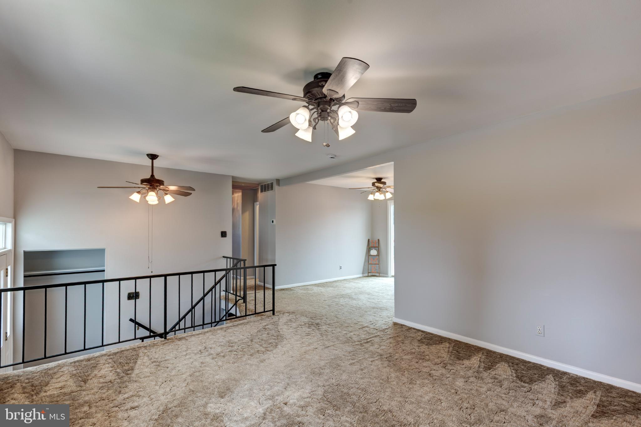 520 Crisfield Road Baltimore, MD 21220 - Photo 10 of 27 a view of a livingroom with a ceiling fan and window