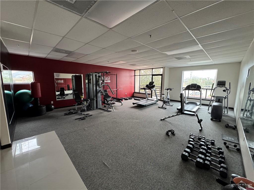 813 Travis Street, Unit 213 Mission, TX 78572 - Photo 14 of 17 a room with gym equipment and a large window