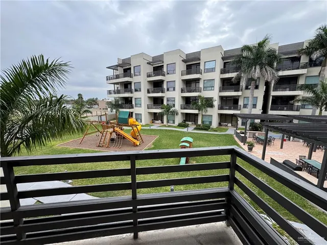 a view of a swimming pool with a balcony
