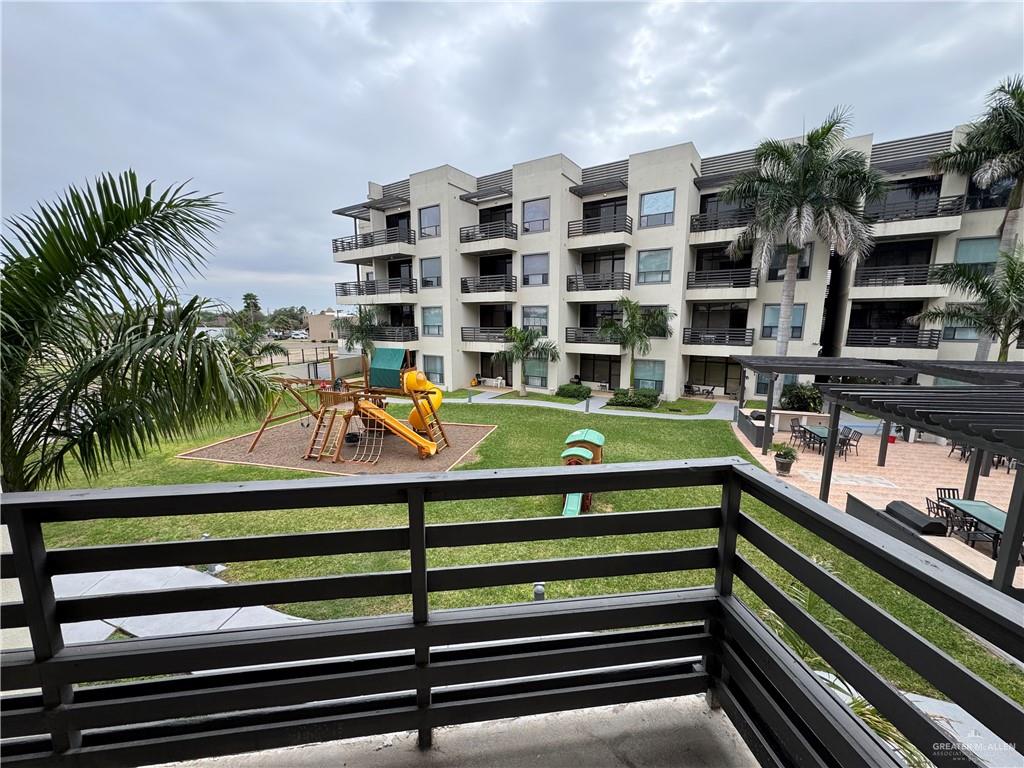 813 Travis Street, Unit 213 Mission, TX 78572 - Photo 6 of 17 a view of a swimming pool with a balcony