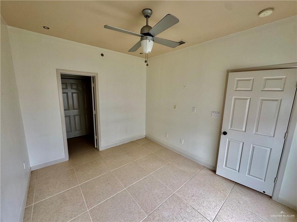 813 Travis Street, Unit 213 Mission, TX 78572 - Photo 8 of 17 a view of an empty room with a bathroom