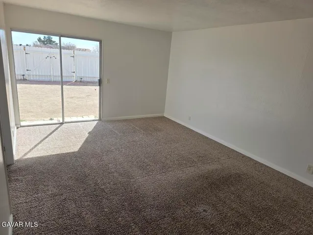 a view of a hallway with a room