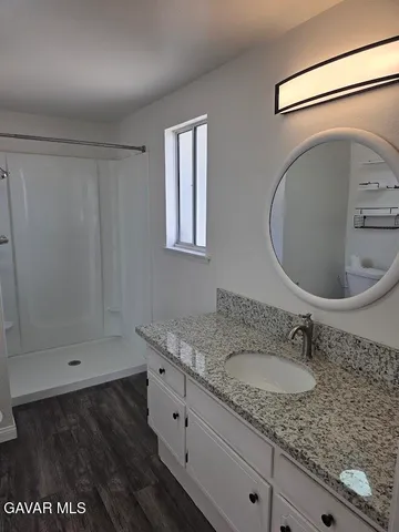 a view of a backyard of the house