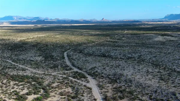 a view of an ocean with a mountain