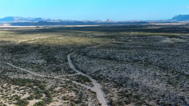 a view of an ocean with a mountain