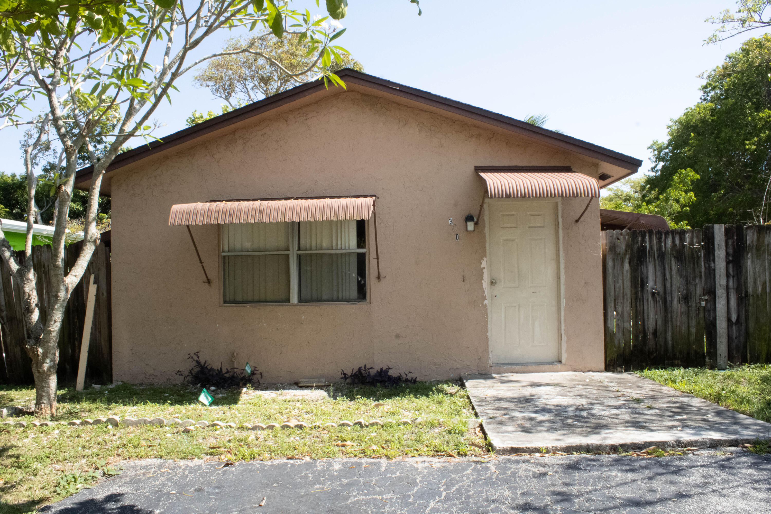 300 Manchester Street Boca Raton, FL 33487 - Photo 1 of 10 a house with trees in front of it