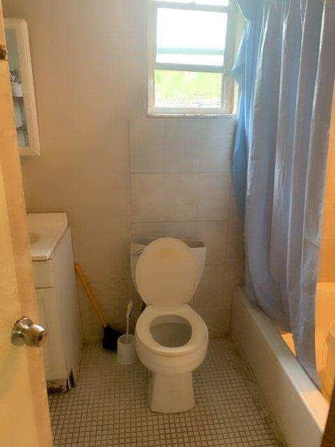 300 Manchester Street Boca Raton, FL 33487 - Photo 5 of 10 a bathroom with a toilet and a shower