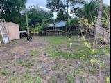 300 Manchester Street Boca Raton, FL 33487 - Photo 8 of 10 a backyard of a house with lots of green space