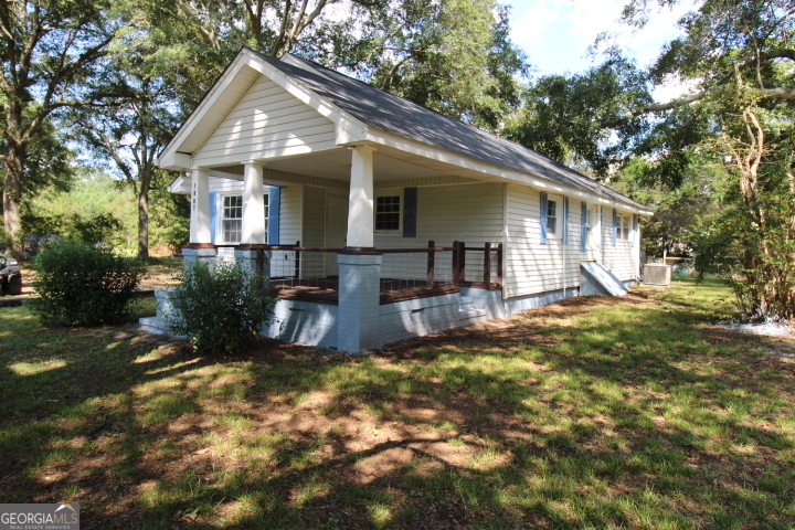 1887 Green Valley Road Griffin, GA 30224 - Photo 4 of 34 a view of a house with backyard and sitting area