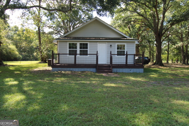 1887 Green Valley Road Griffin, GA 30224 - Photo 6 of 34 a front view of a house with a garden