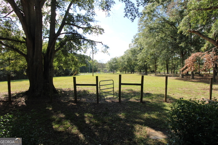 1887 Green Valley Road Griffin, GA 30224 - Photo 10 of 34 a view of a bench in a garden