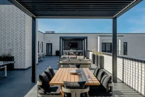 a view of a patio with table and chairs