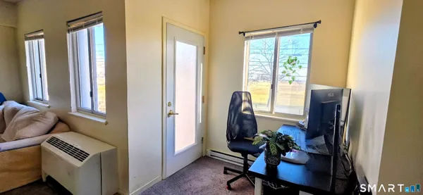 a bedroom with a bed and a mirror