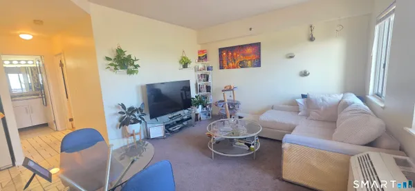 a room with furniture and a flat screen tv