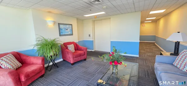 a view of a water with palm trees