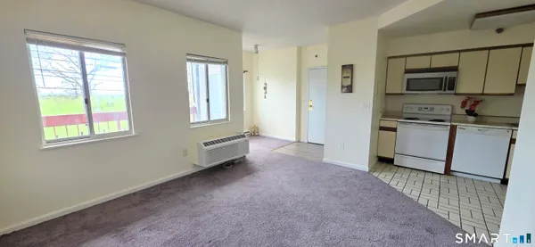 a kitchen with stainless steel appliances a refrigerator sink and cabinets