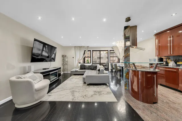 a living room with fireplace furniture and a flat screen tv