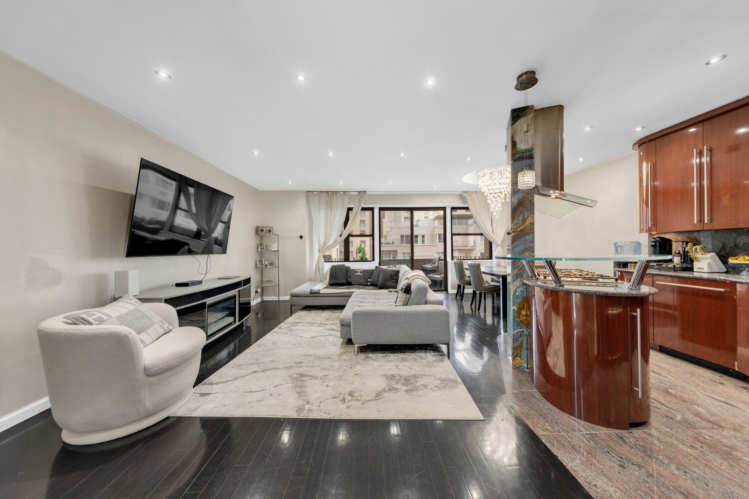 a living room with fireplace furniture and a flat screen tv
