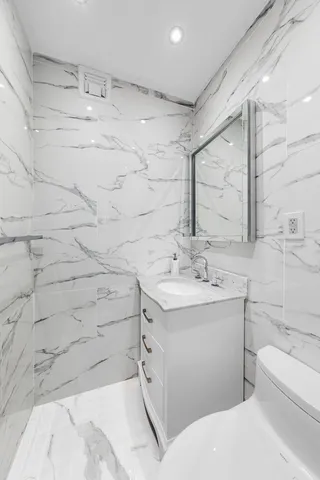 a bathroom with a sink and mirror