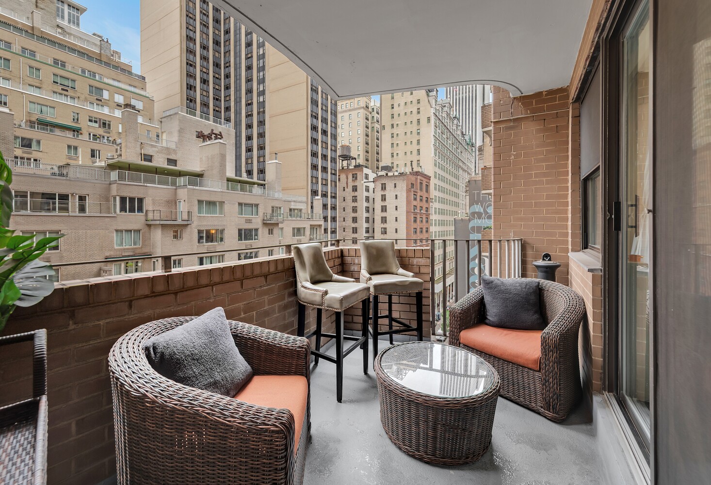 58 West 58th Street, Unit 9A Manhattan, NY 10019 - Photo 6 of 7 a outdoor living room with furniture and a floor to ceiling window