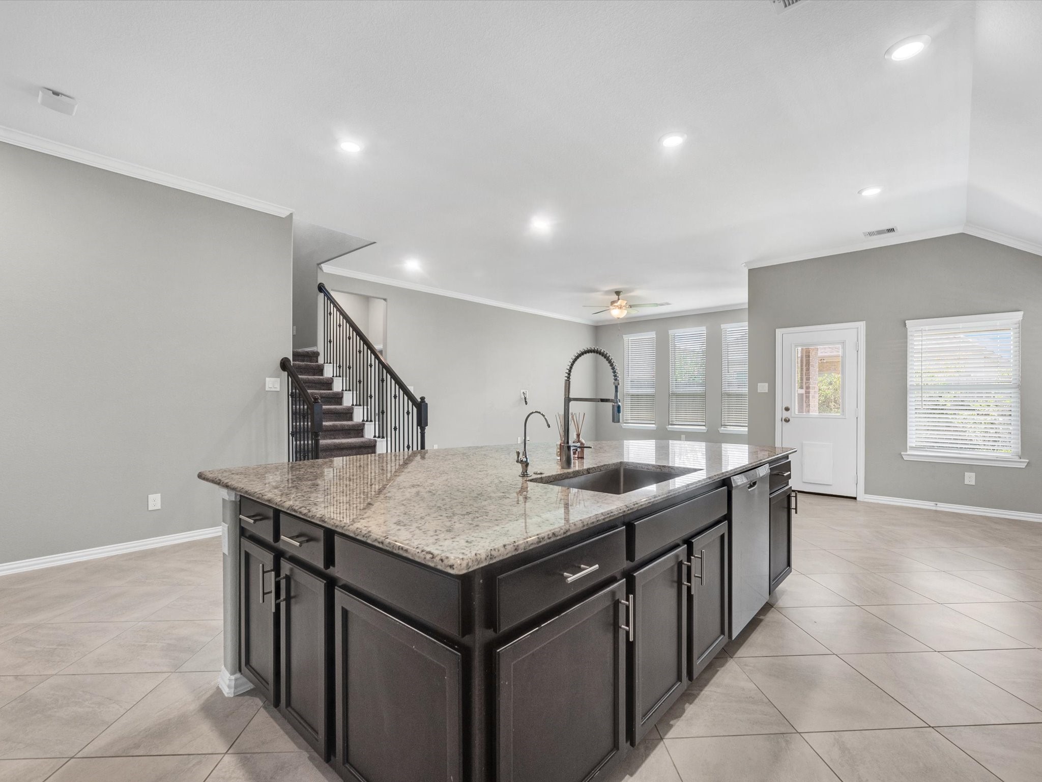 31120 Aspen Gate Trail Spring, TX 77386 - Photo 11 of 33 a dining hall with stainless steel appliances granite countertop a sink and a white countertops with wooden floor