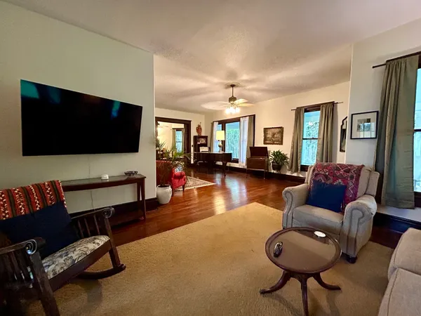 a living room with furniture and a flat screen tv