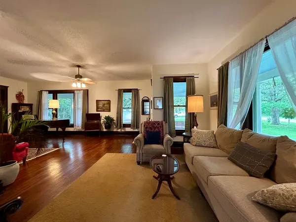 a living room with furniture and a large window