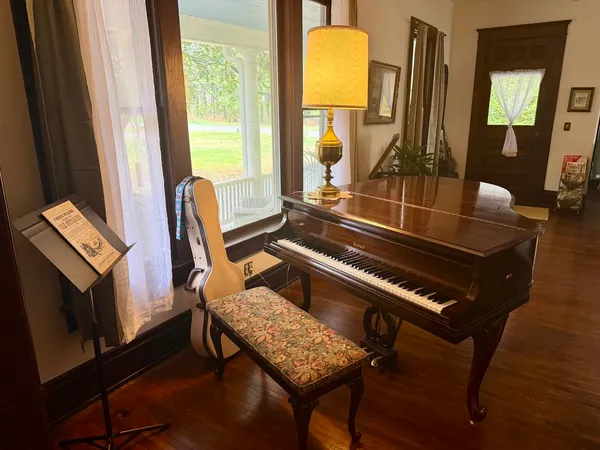 a view of a livingroom with furniture and front door