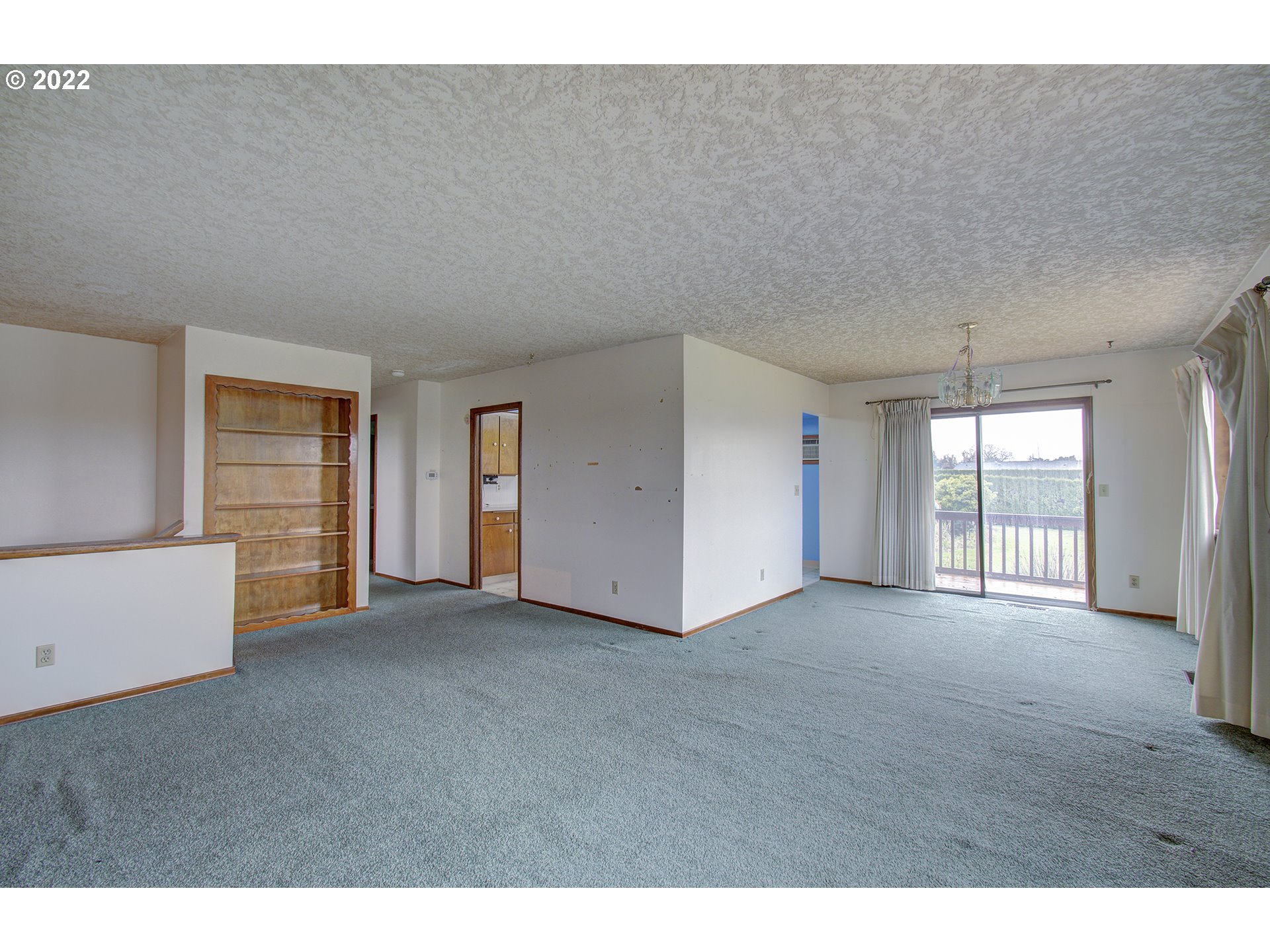 215 Northwest 189th Street Ridgefield, WA 98642 - Photo 8 of 26 a view of an empty room with a window