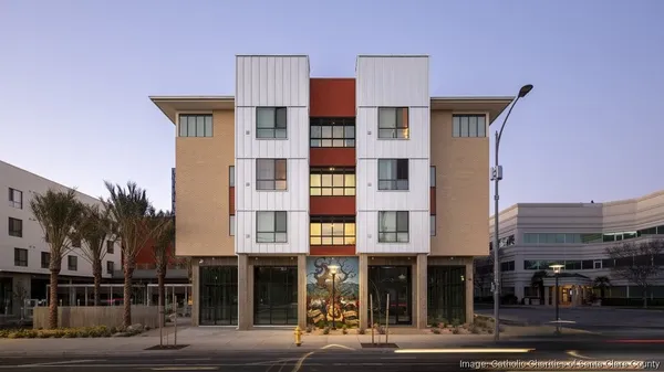 a front view of multi story residential apartment building