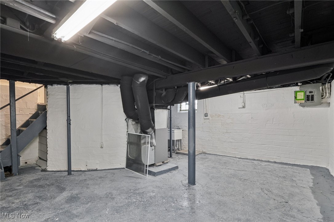 1469 South Noble Road Cleveland, OH 44121 - Photo 24 of 29 Basement with stairs and heating unit
